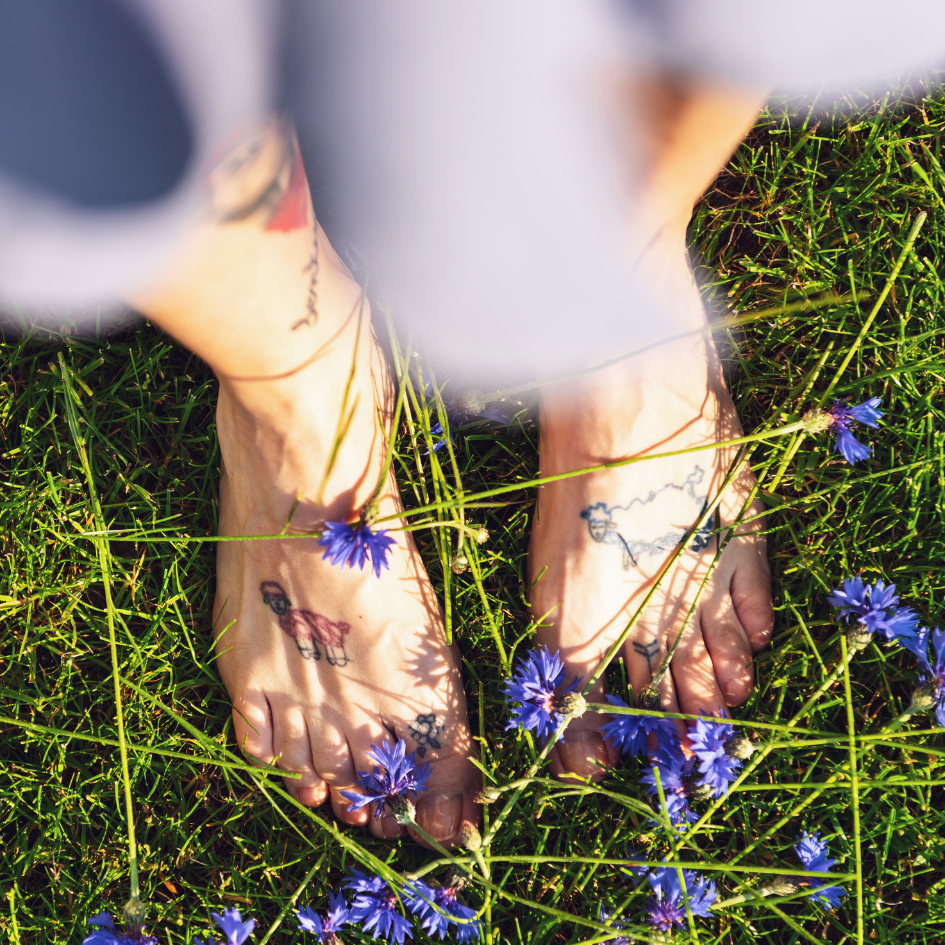 Photo of bare feet on grass