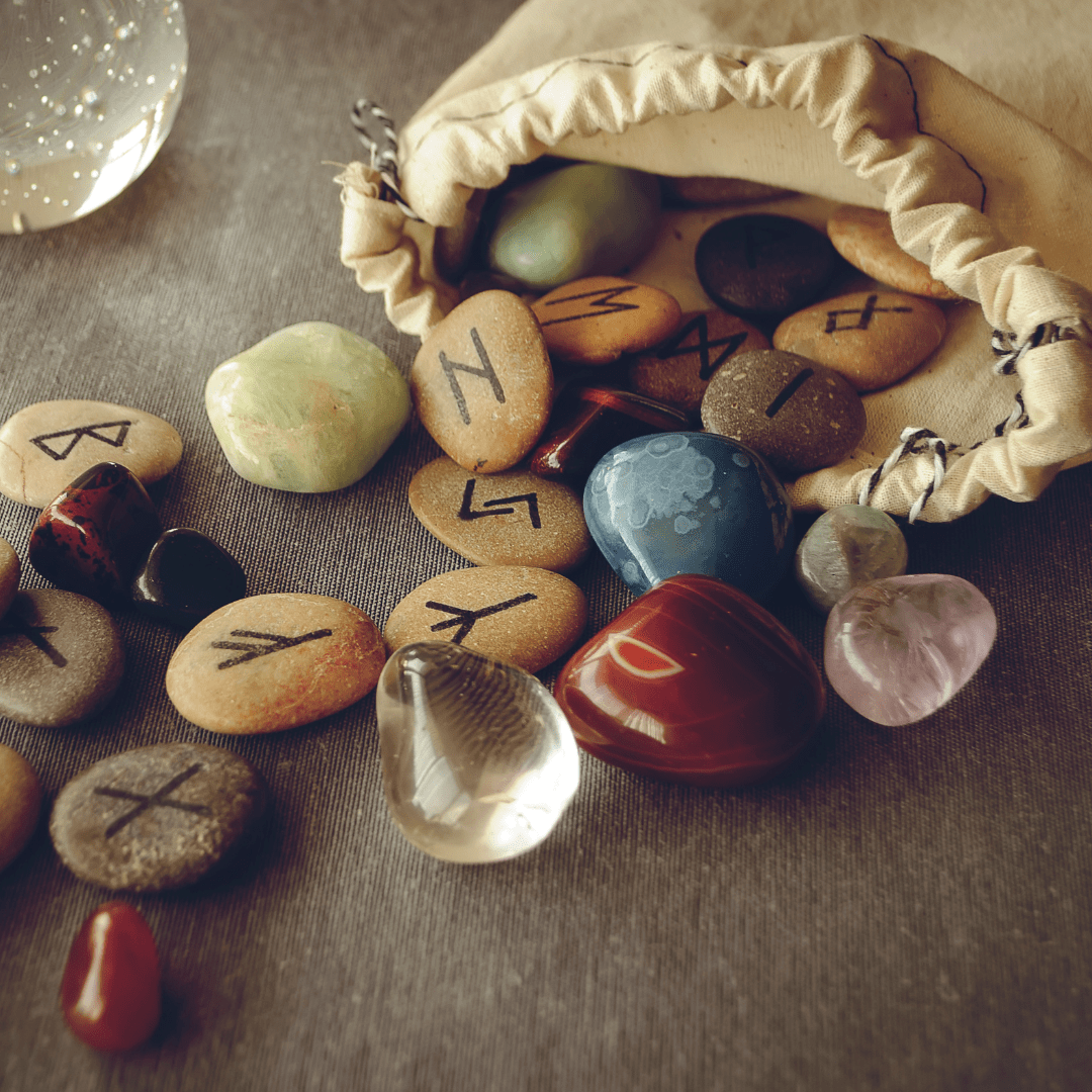rune stones coming out of a cloth pouch